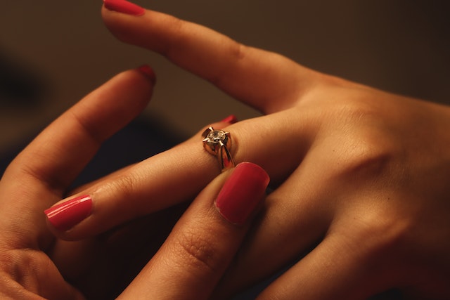 a finger wearing a ring