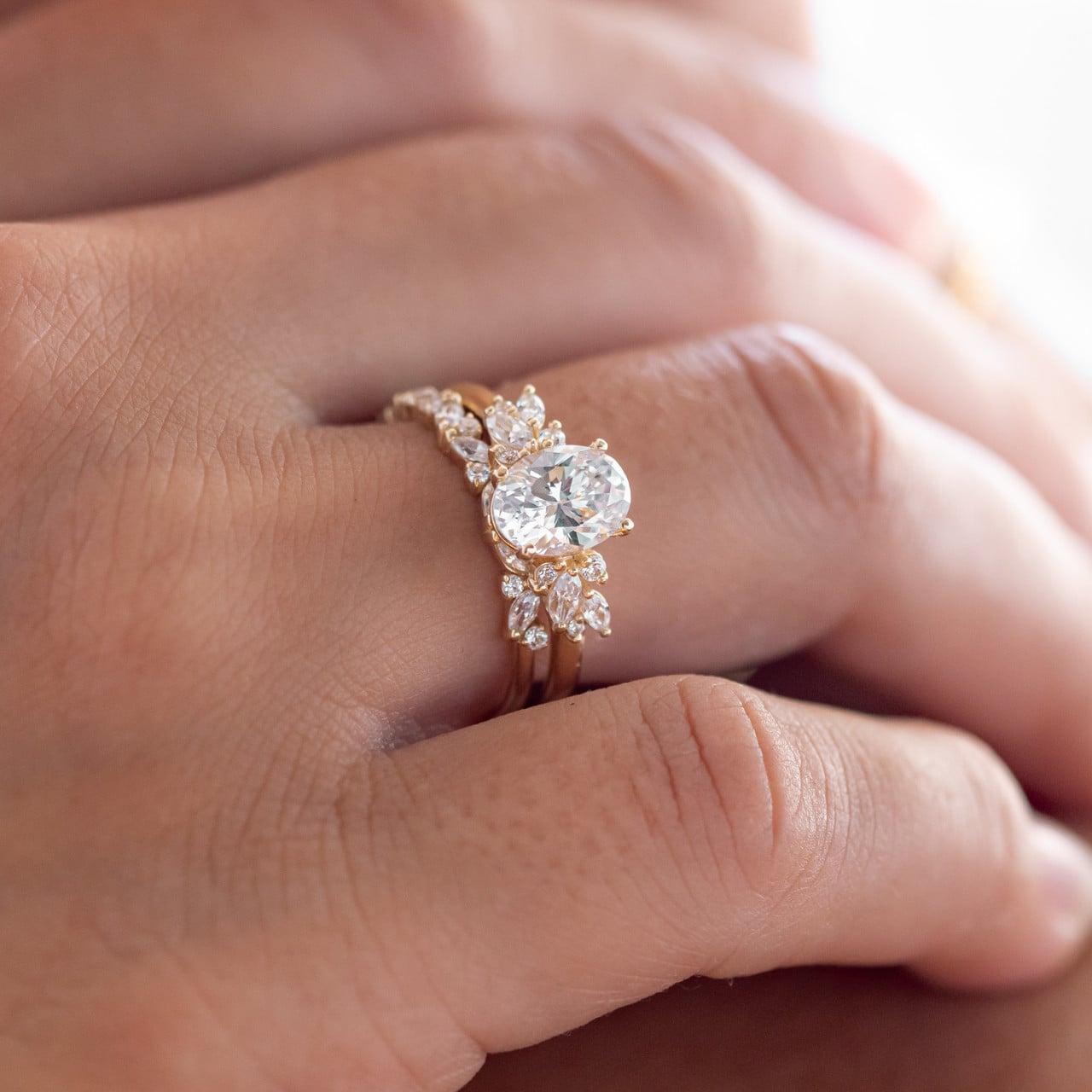 oval cut cluster diamond engagement ring