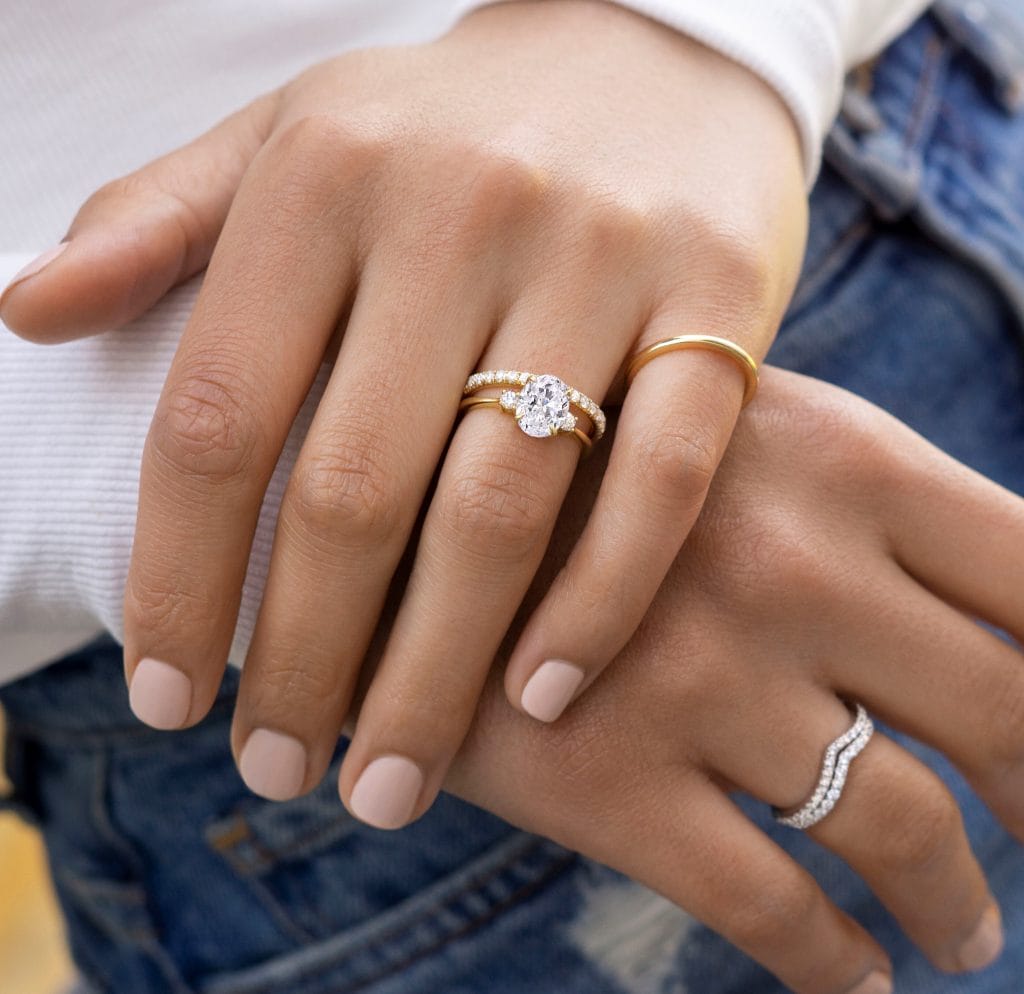 a woman wearing gold diamond rings
