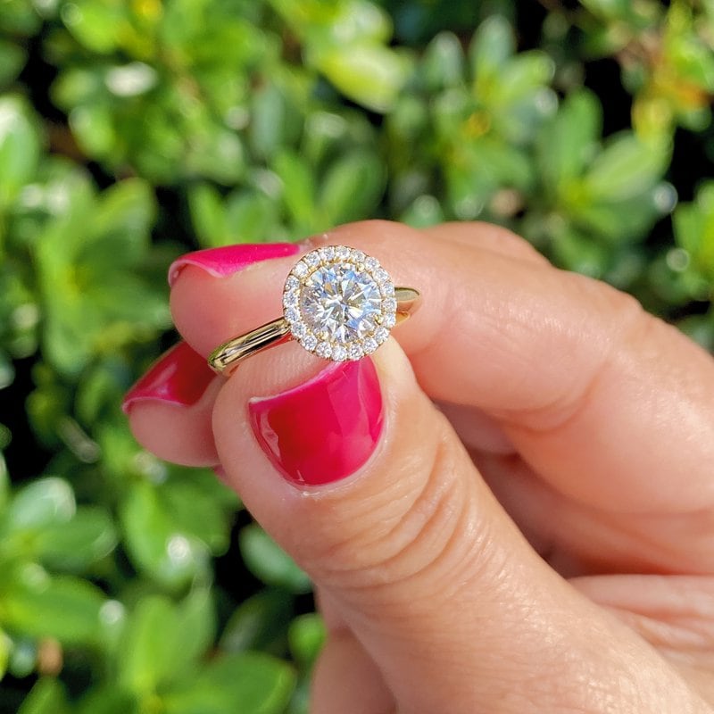 diamond halo engagement ring in yellow gold setting