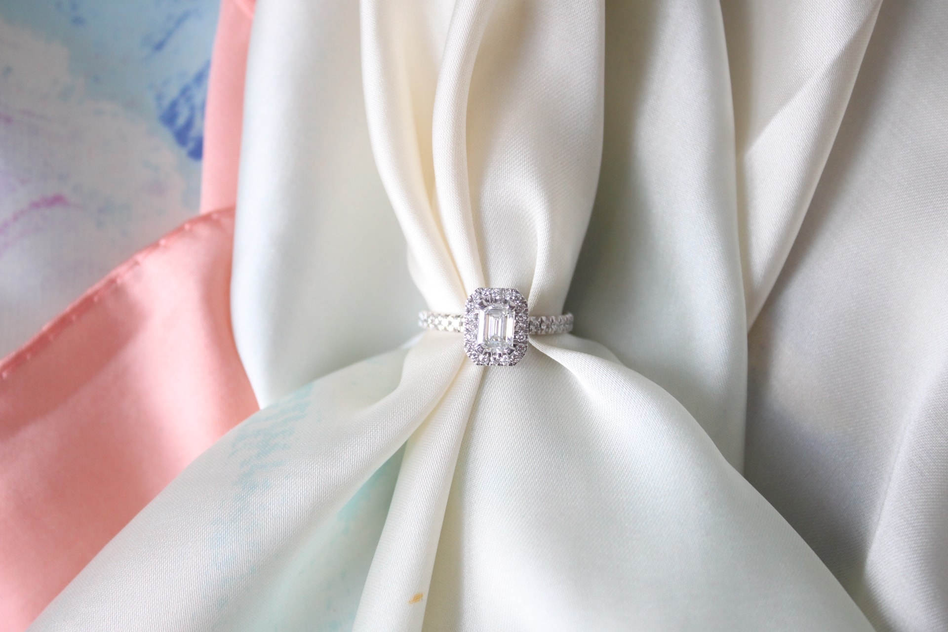 emerald cut diamond ring on a beautiful backdrop