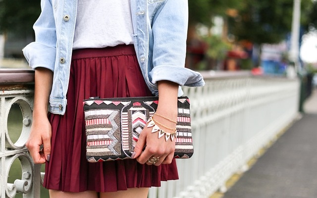 woman with layered bracelets with one large one