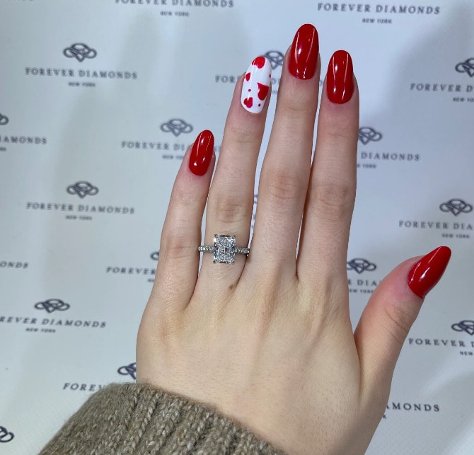 radiant cut diamond engagement ring on the ring finger