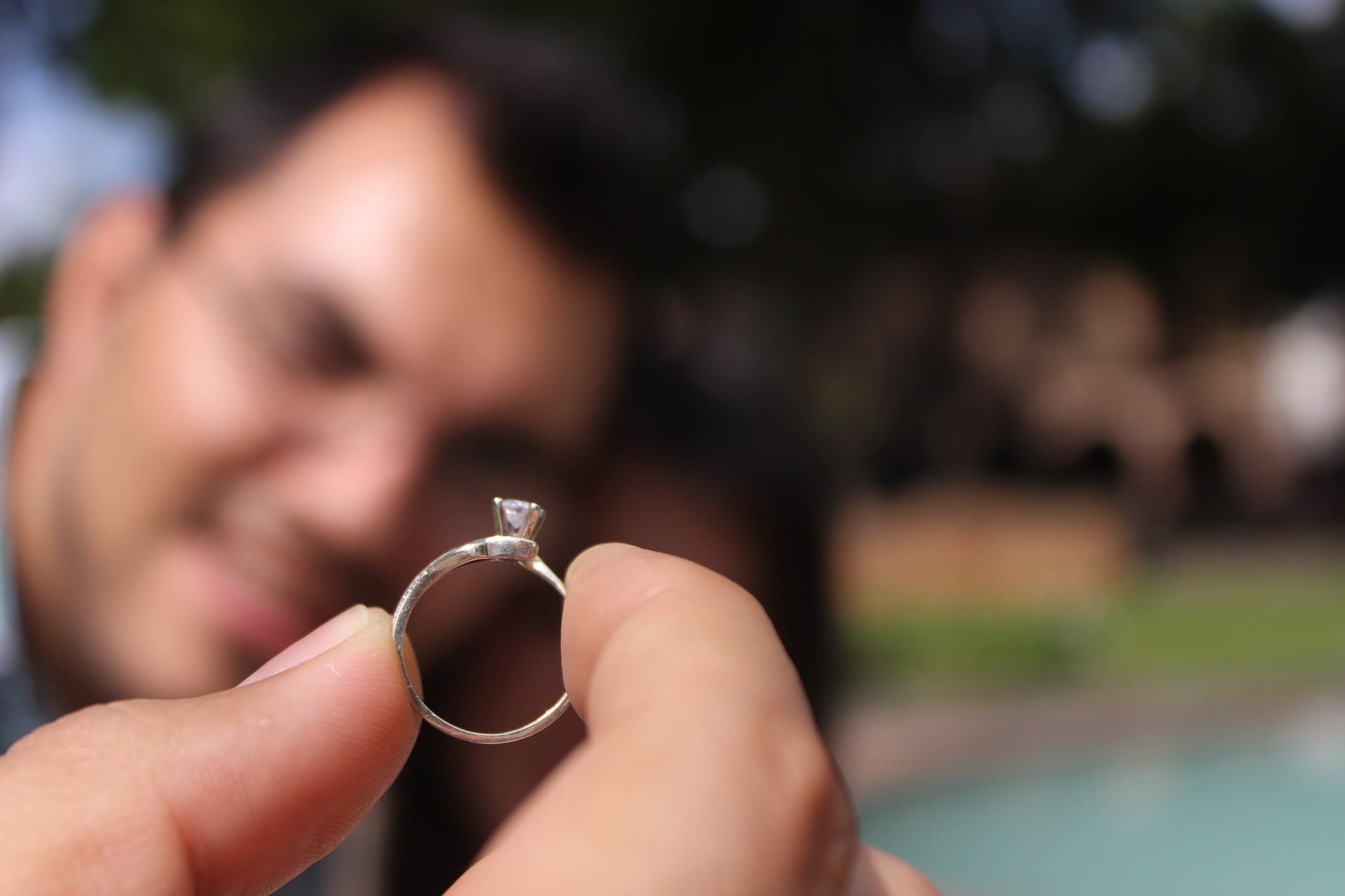 Man showing engagement ring