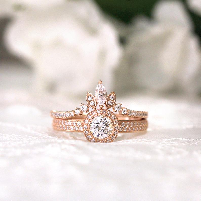 a pair of curved band and engagement ring