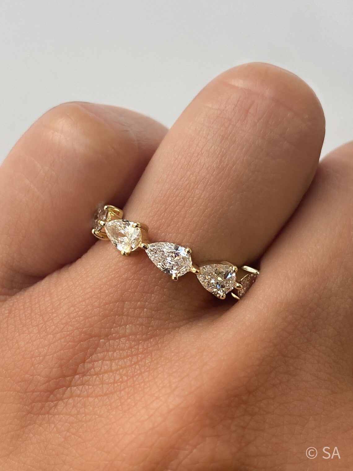 East-West pear shape half eternity band