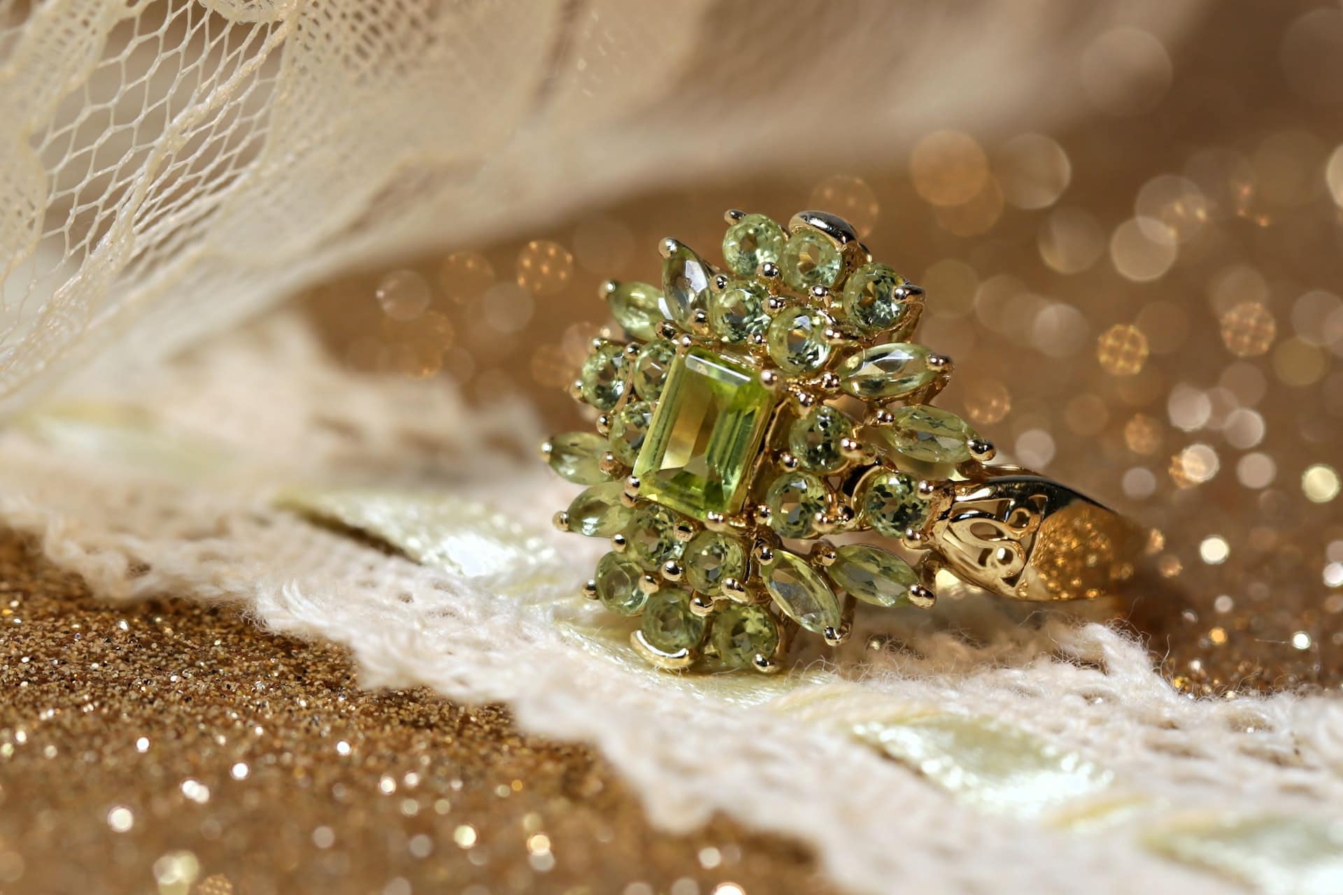 peridot ring on gold background