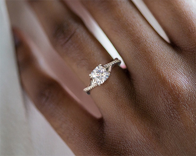radiant cut diamond ring on hand