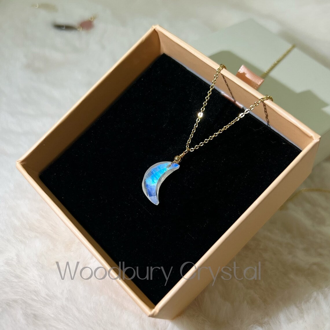 rainbow moonstone necklace on a jewelry box
