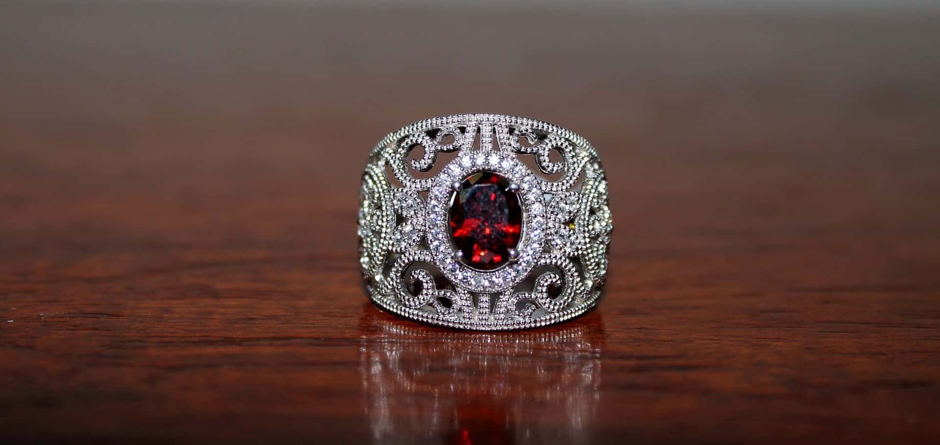 Red garnet ring with diamond close up