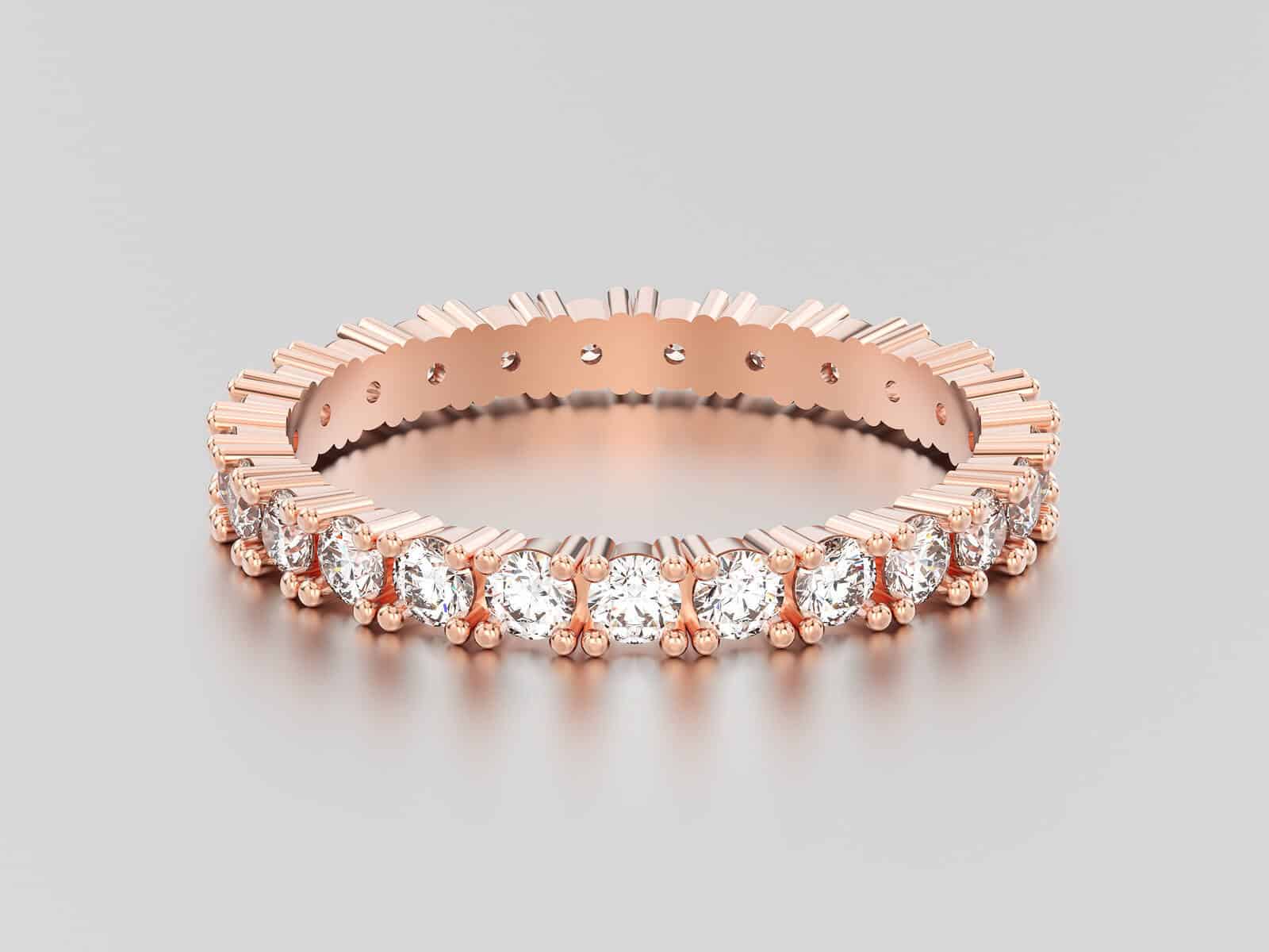 ose gold eternity band diamond ring with reflection and shadow on a grey background