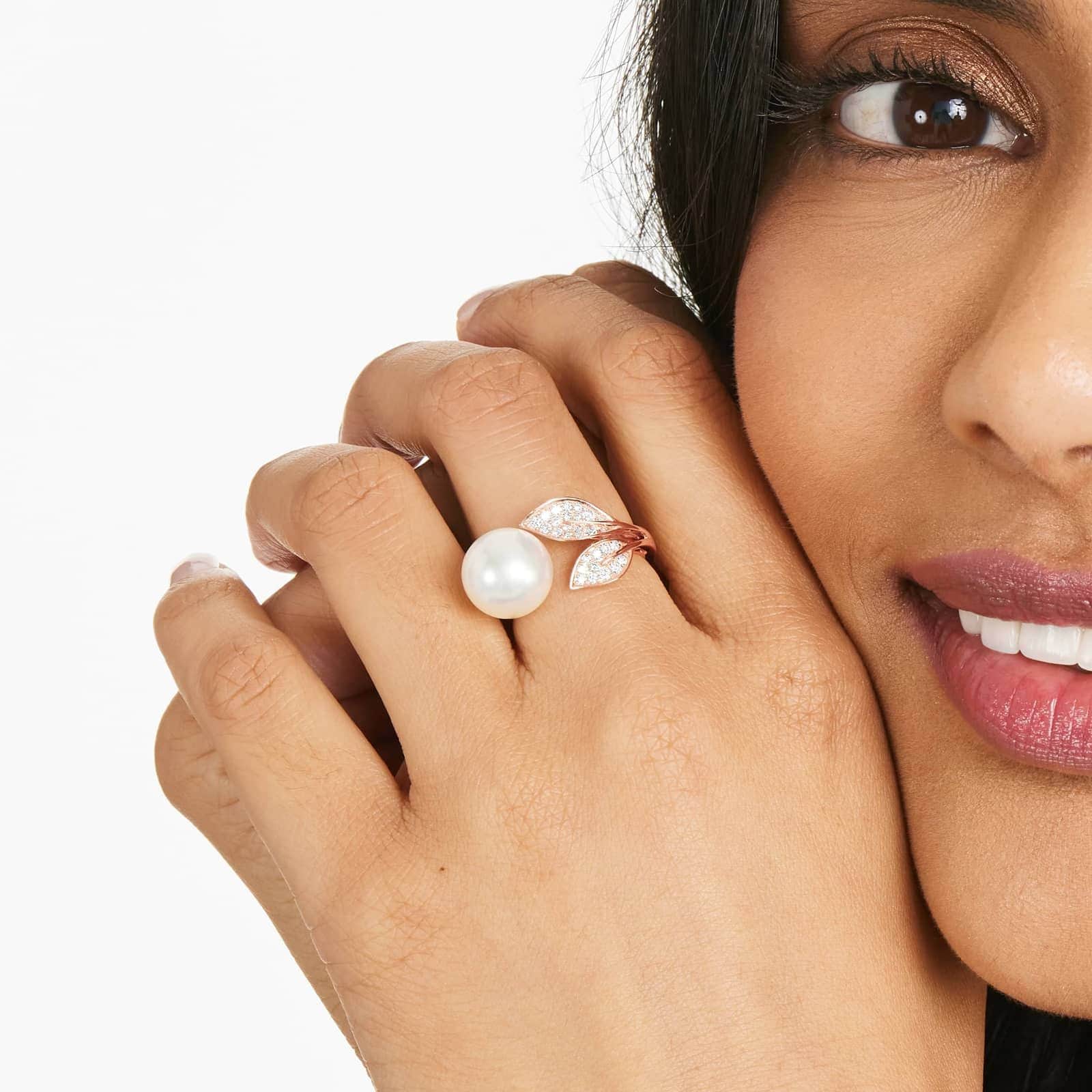 south sea pearl and diamond ring on the woman's finger