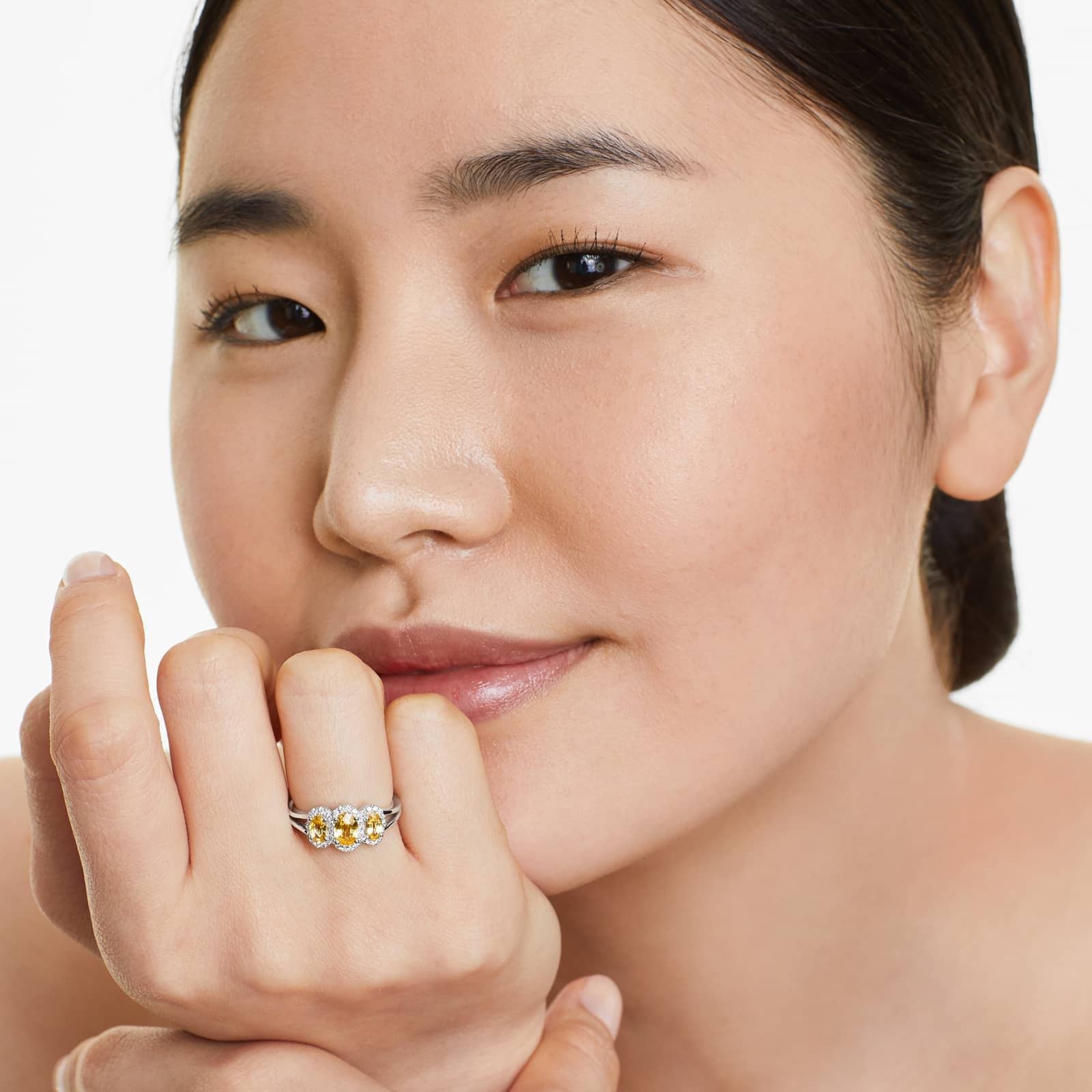 Girl wearing Three Stone Halo Yellow Sapphire