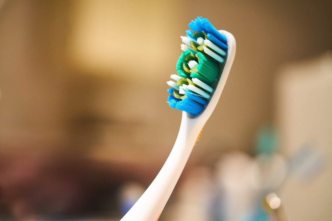 Cleaning platinum ring with toothbrush