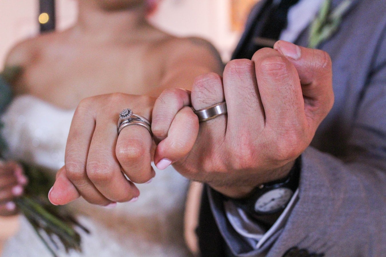 Bride and groom pinky promise
