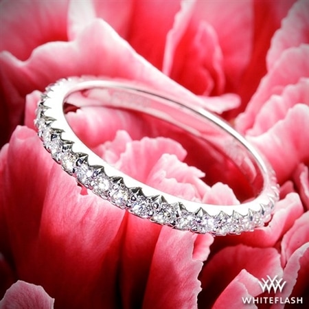 rounf diamond wedding ring with red petals background