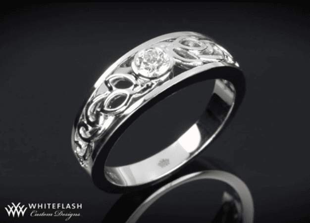 bezel set filigree wedding band in black background