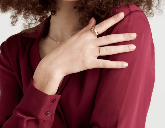 gold bold stacker ring and twisted ring on fingers