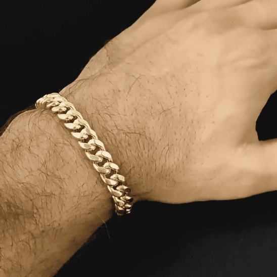 gold cuban chain bracelet on a man's wrist