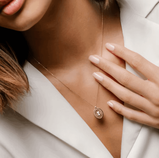 inner spirit medallion necklace on the woman's neck
