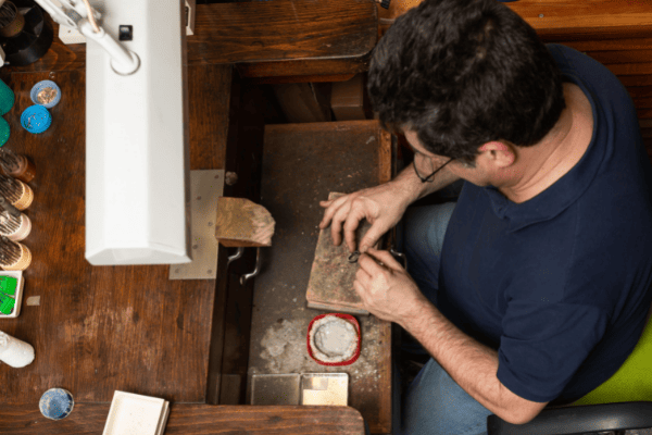 a man soldering wedding rings