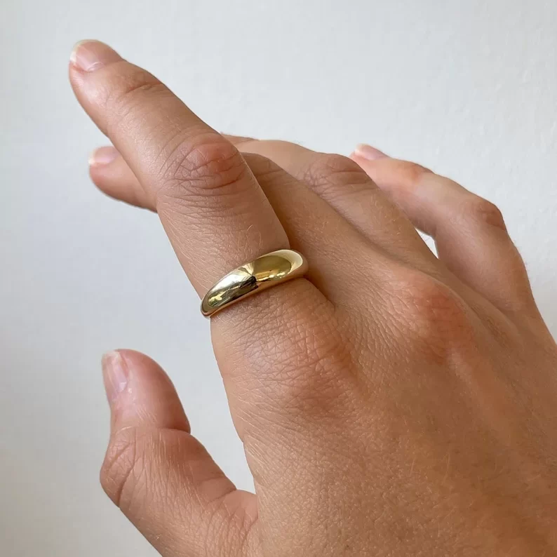 10k gold dome ring on the index finger