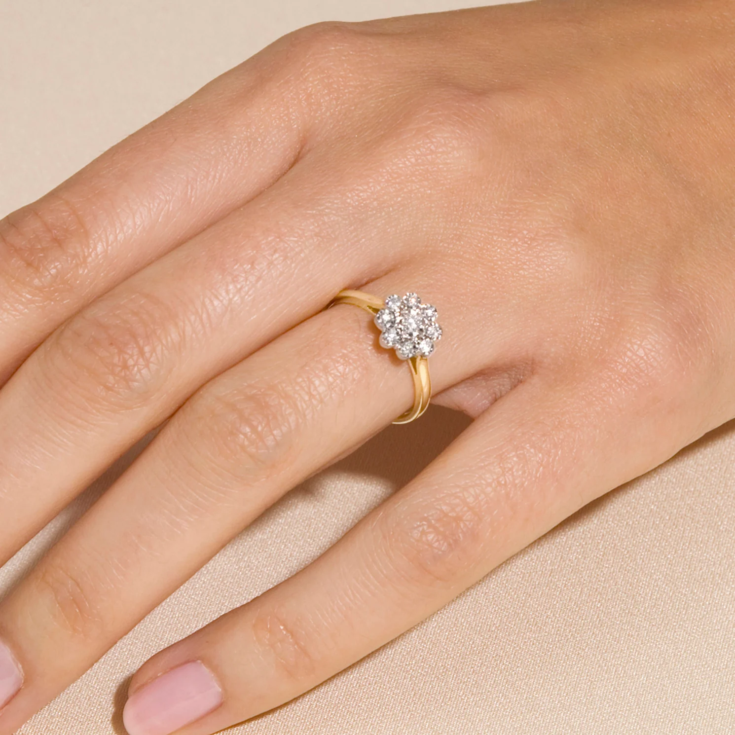 round diamond engagement ring on the ring finger