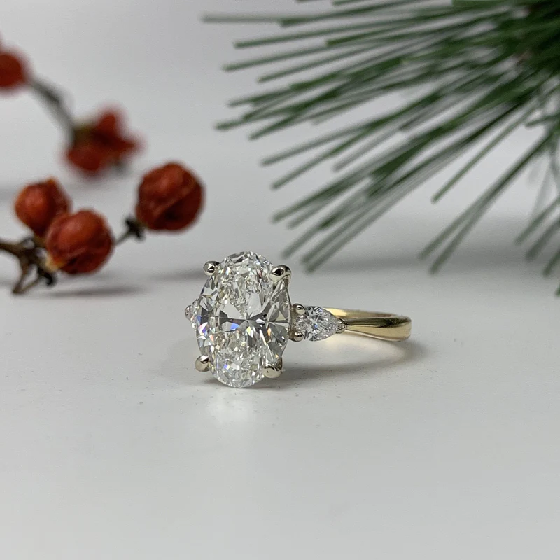 oval cut diamond engagement ring in yellow gold setting