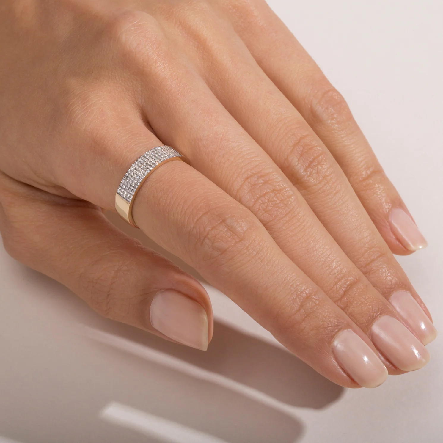 diamond cigar band on the finger