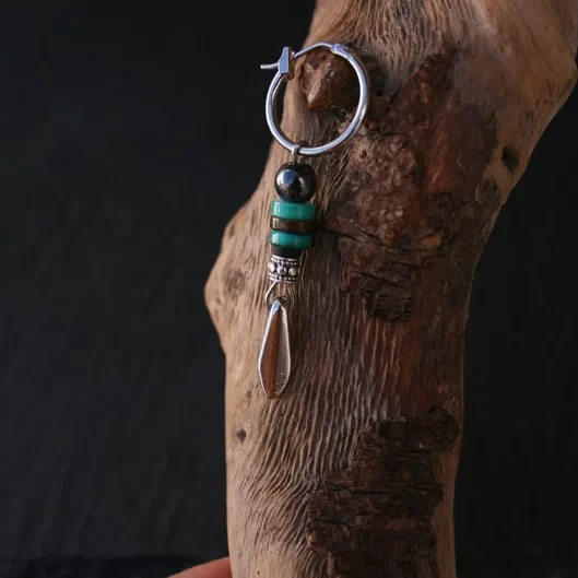 One spike earring man