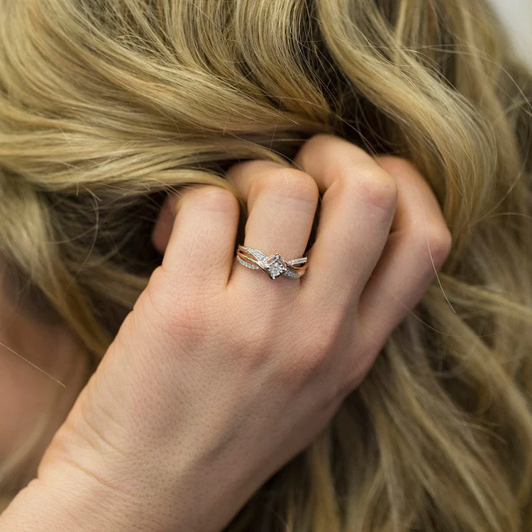 princess cut diamond engagement ring on the woman's finger