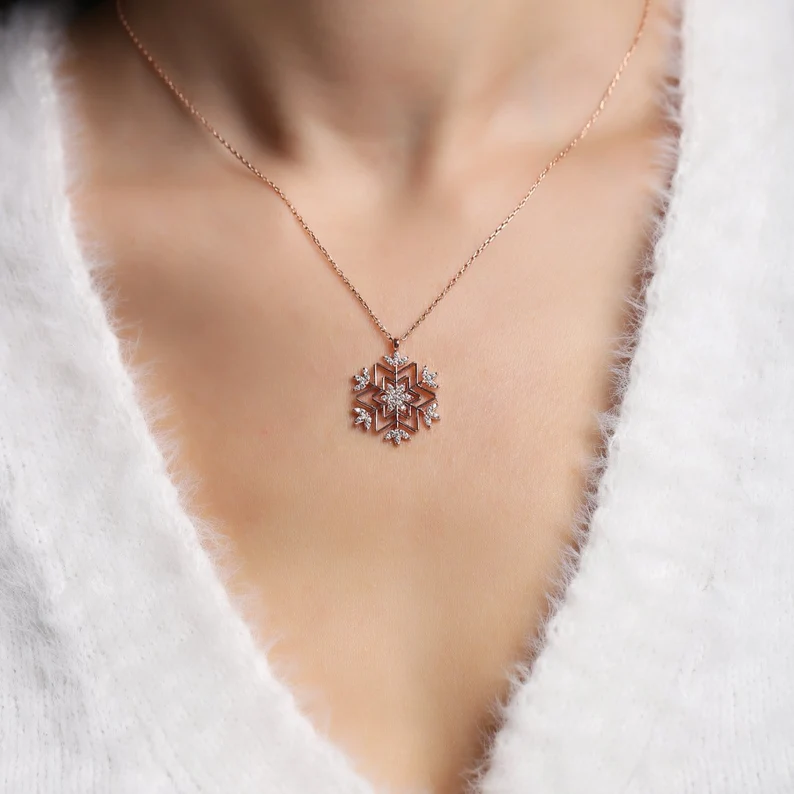 snowflake necklace on the neck